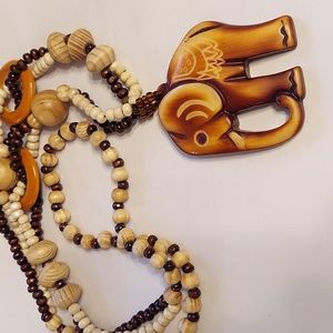Carved elephant on a carved beaded necklace.